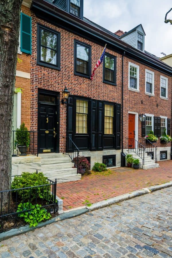 Historic brick row houses on a cobblestone street in Society Hill, Philadelphia, Pennsylvania.